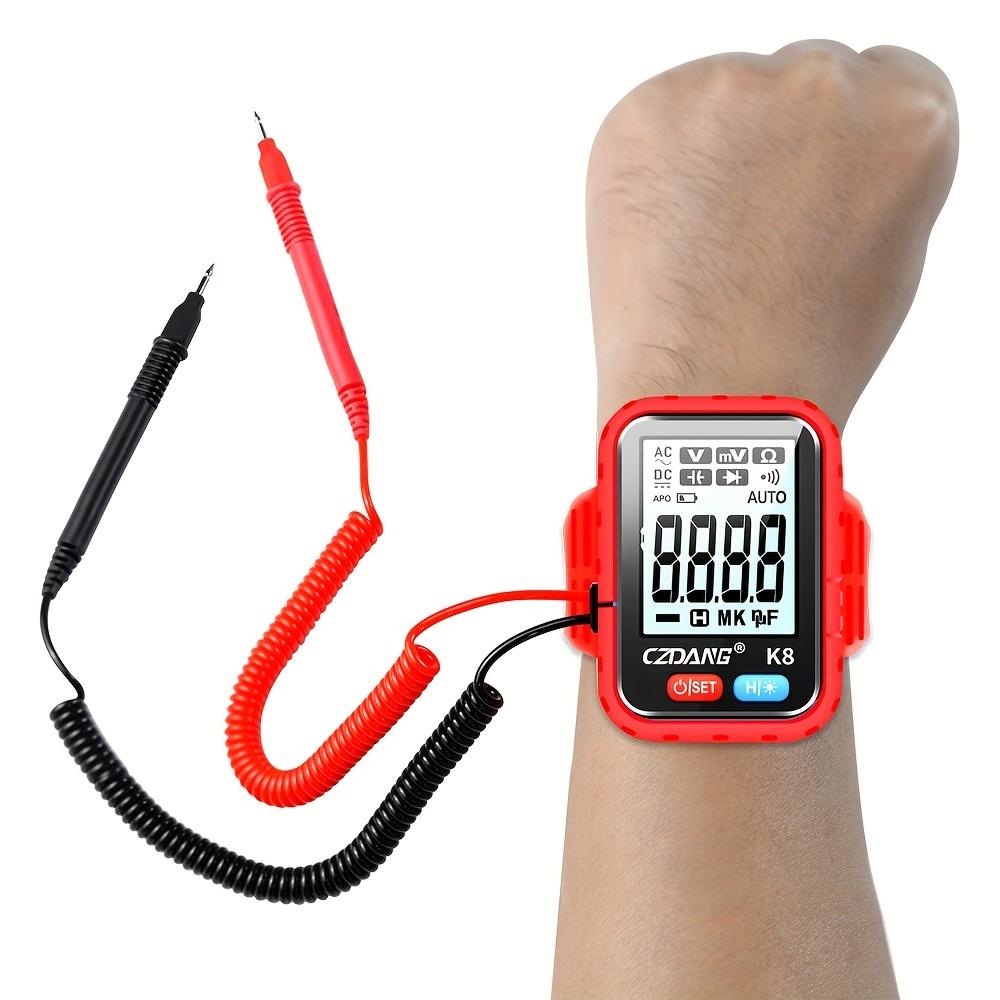 Bracelet portable de style mini avec un testeur multimètre numérique qui peut mesurer la tension continue, la tension alternative, la résistance et la continuité.