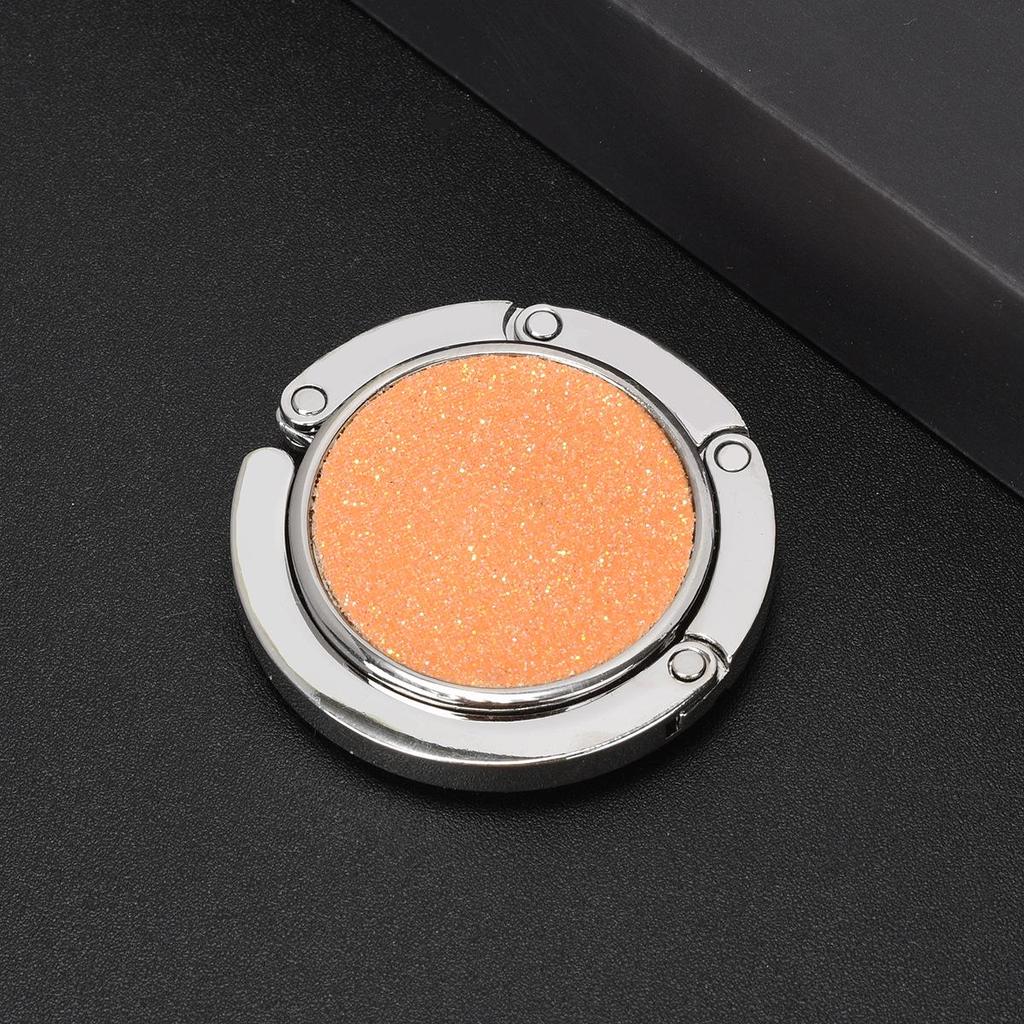 Kulatý skládací háček na kabelku – Přenosný kreativní věšák na batoh na okraj stolu.