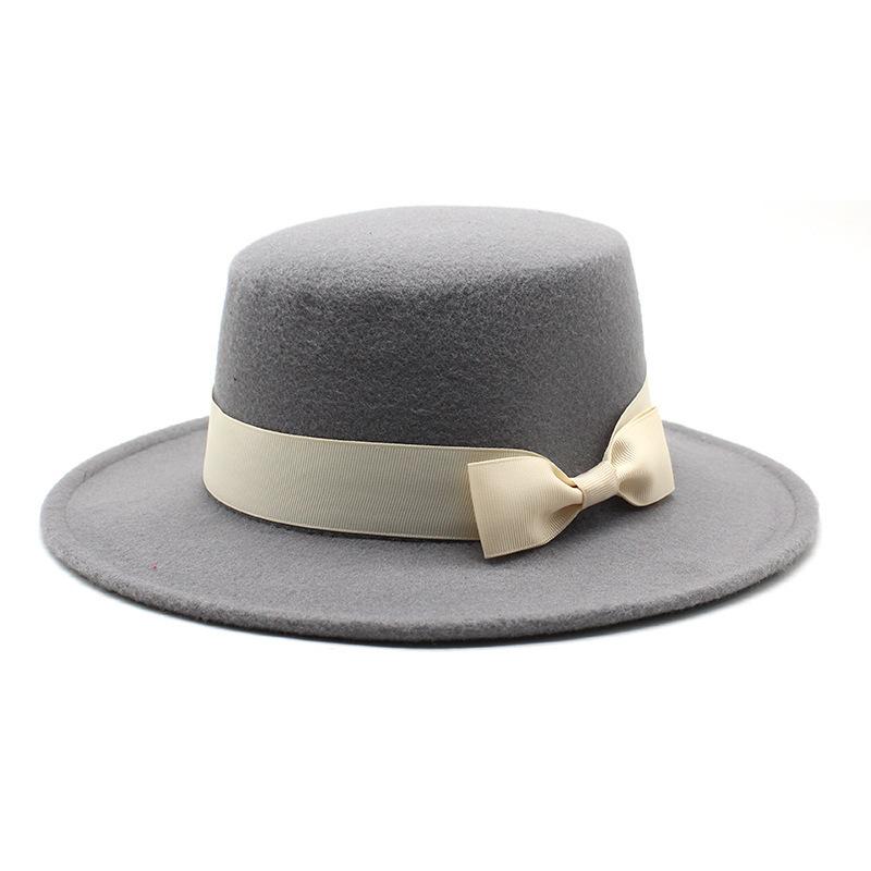 New style autumn and winter men's and women's flat-brimmed hats, fashion bows, flat-topped top hats, men's and women's woolen jazz hats