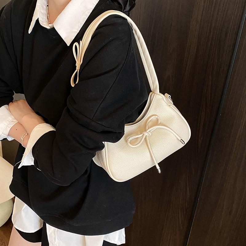 Fashion casual bow shoulder bag new high value sense crossbody armpit dumpling bag