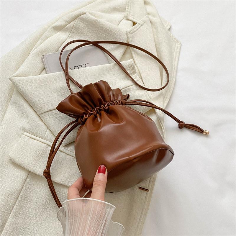 Fashionable Simple Bucket Bag For Women With Soft Structure Available In Black White Brown And Fuchsia