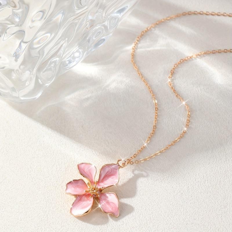 Fashion flower pendant necklace with white enamel petals. Elegant daily jewelry for casual, formal and vacation wear, perfect gift for women.
