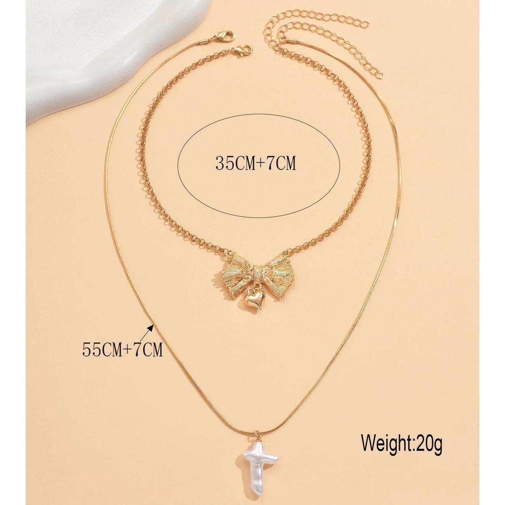 Europäische und amerikanische Doppelreihen-Schleife Herz Kunstperlen-Anhänger Halskette für Damen - High-End Nischendesign