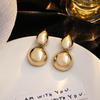 European & American Metal Oval Geometric Earrings: Retro Round Studs with Light Luxury, Unique Personality & Elegant Style