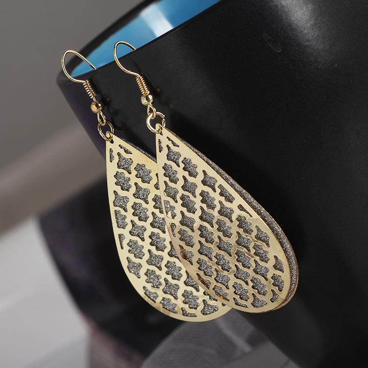 

Матовые геометрические серьги-кисточки с листьями - Креативный полый круглый дизайн