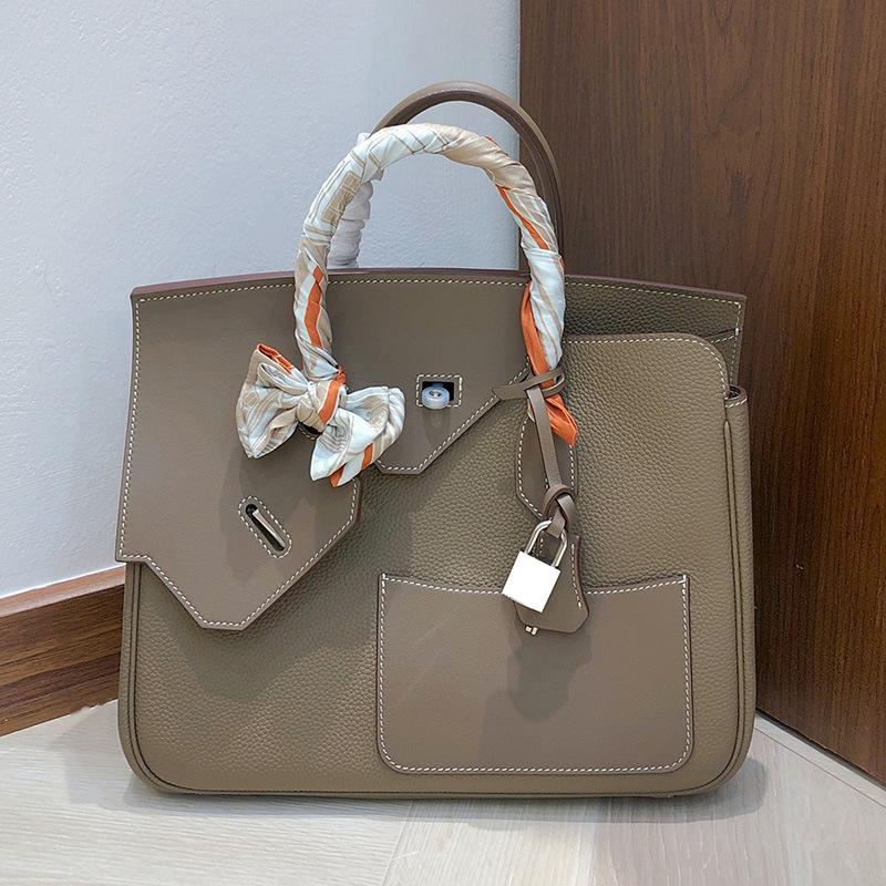 

High Spec Top Layer Cowhide Platinum Bag With Patchwork Contrasting Colors Irregular Leather Women s Bag Handbag Large Capacity Pocket Bag 30x12x25cm сірий/срібний