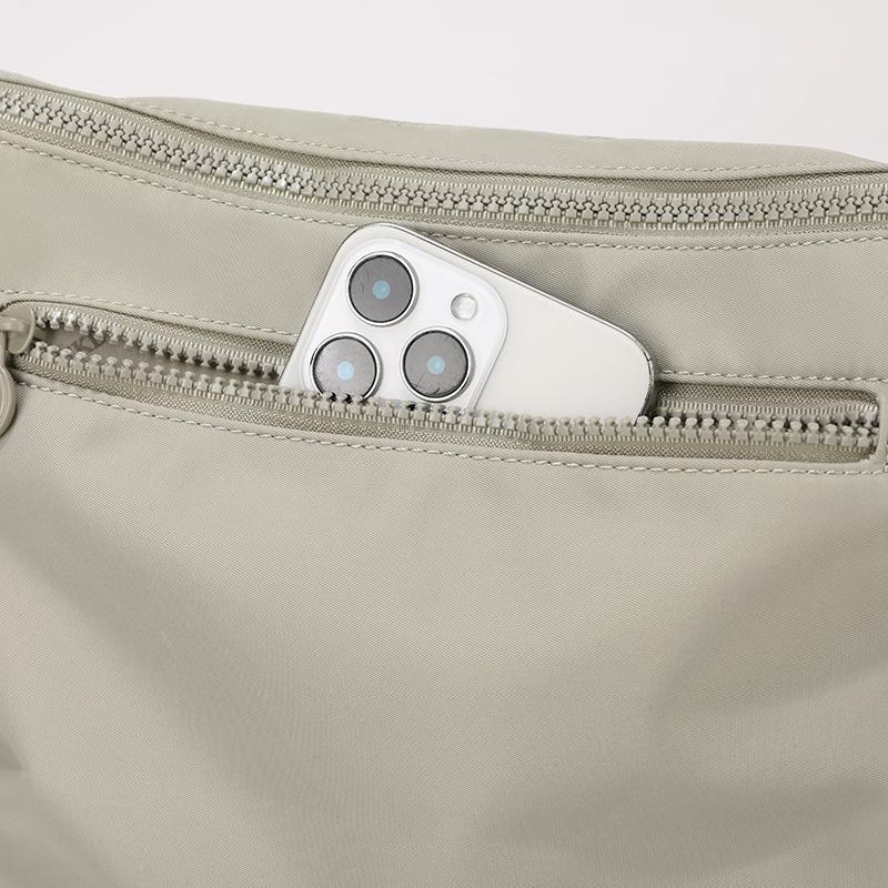 Elegant Slouch Shoulder Bag with Top Zip Closure Adjustable Strap Geometric Stitching and Smooth Nylon Fabric for Modern Daily Wear and Commuting
