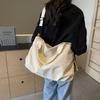 Handheld cloth bag women's bag with high texture and large capacity shoulder messenger bag, lazy and romantic to go to work, storage large bag