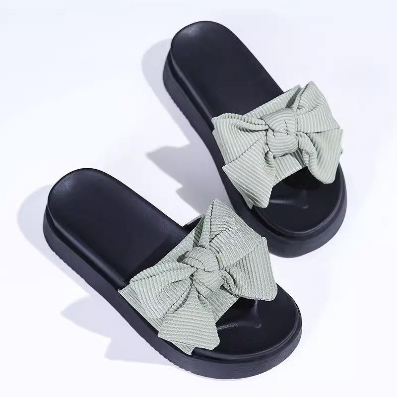 Black bow-tied one-word slippers for women's summer wear, new muffin thick-bottomed non-slip, advanced cool slippers