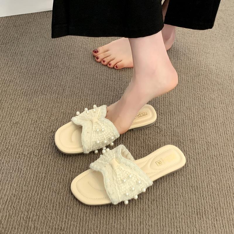 French small fragrant pearl slippers women's summer wear 2025 new fashion and leisure one-word flat-bottomed beach cool slippers