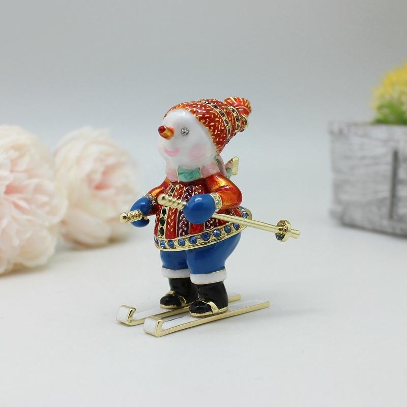 Nový vánoční dárek Smaltovaná barva Lyžující sněhulák Kreativní malé ozdoby Úložný box Stolní malé ozdoby