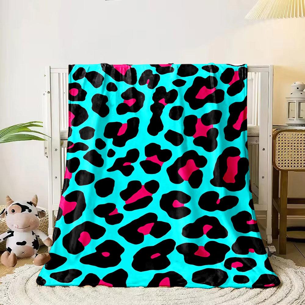 

Bright turquoise background with black and pink leopard-style spots. for all seasons blanket lunch break throw gift 80cm x 120cm