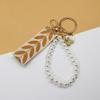 Trending 2025 Keychain Set Fashion Minimalist Pearl Car Keychain Woven Stripe Bag Charm Elegant Women Keychain Organizer Gift