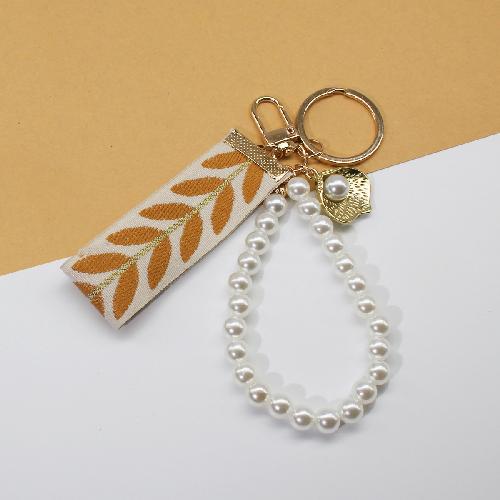 Trending 2025 Keychain Set Fashion Minimalist Pearl Car Keychain Woven Stripe Bag Charm Elegant Women Keychain Organizer Gift