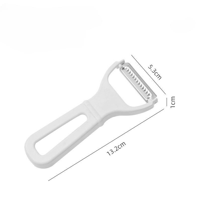 Škrabka a kráječ, kuchyňský nástroj na loupání a krájení ovoce a zeleniny. Šetří námahu a lze jej použít k zavěšení kráječe