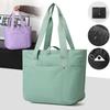 Women's portable folding storage bag with multiple compartments and adjustable shoulder strap for large capacity.