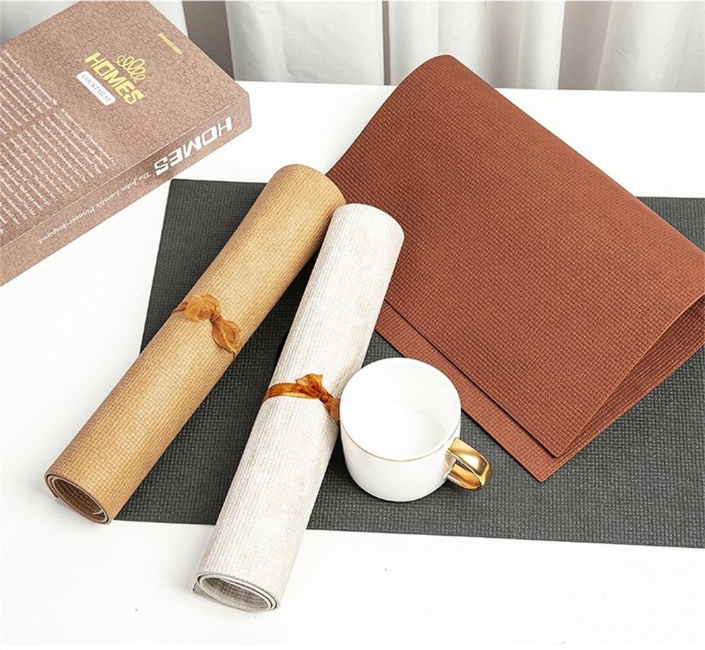 Stylish Woven-pattern Rectangular Leather Placemats, Heat-resistant and Non-slip, Perfect for Modern Home Decor.