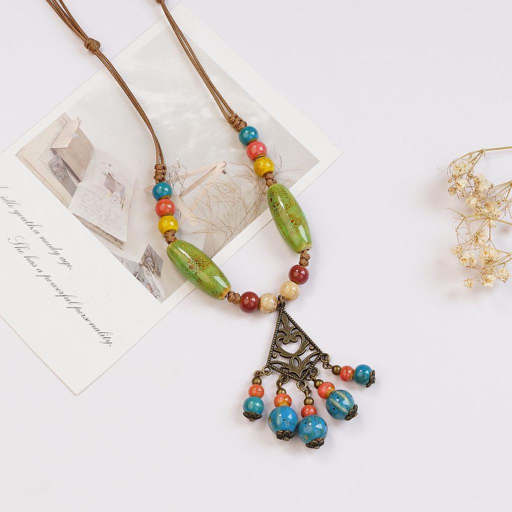 Ethnic style ceramic butterfly bell pendant necklace design sense new trendy long sweater chain