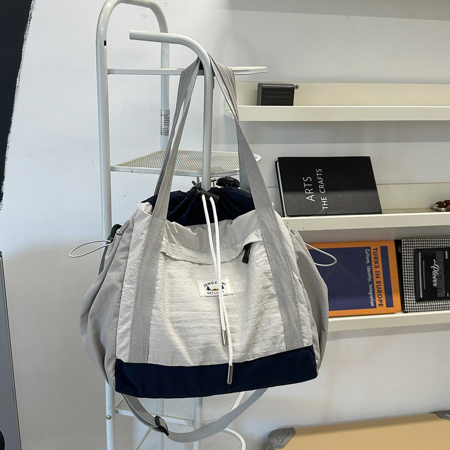 

Korean bag 2025 new large-capacity unisex shoulder messenger bag fashion trend commuter tote bag women