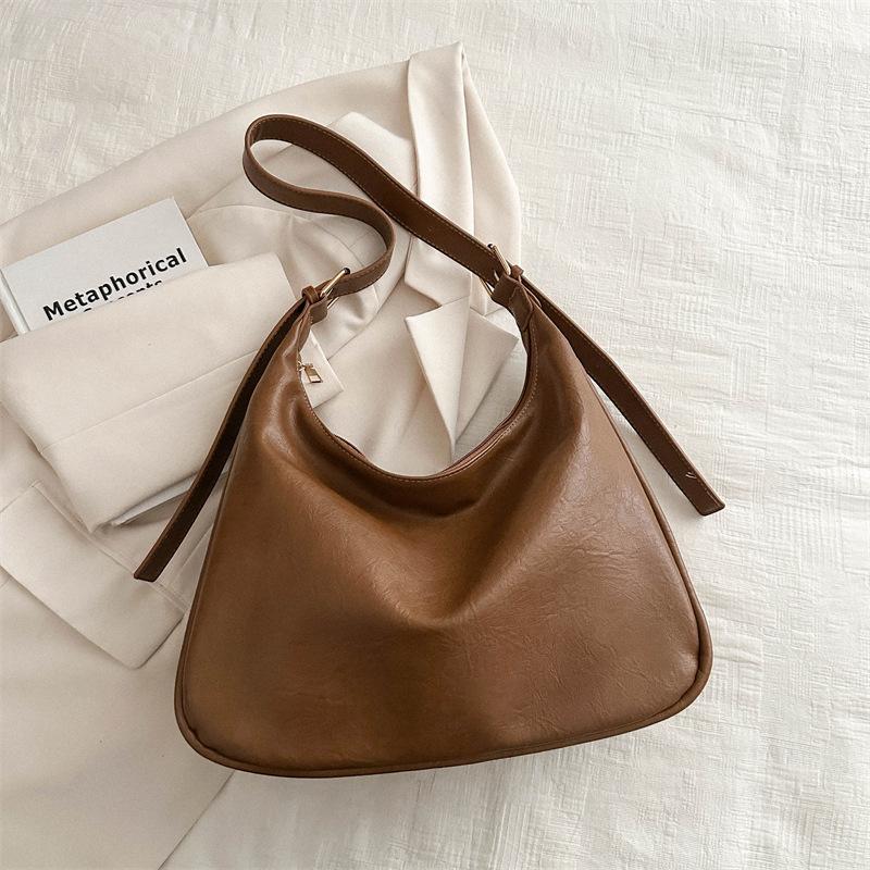 

Простая ретро-сумка 2025 весна новая сумка женская простая портативная повседневная сумка модная наплечная сумка-тоут для женщин светло-коричневого