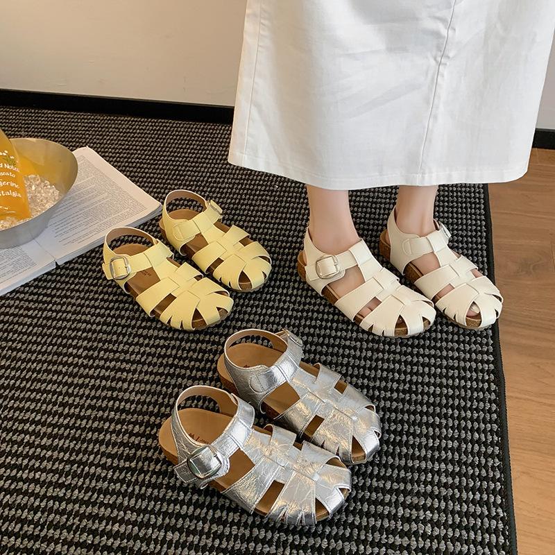 Woven hollow bag head sandals female 2025 new summer with skirt fairy style flat bottom versatile casual pig cage shoes