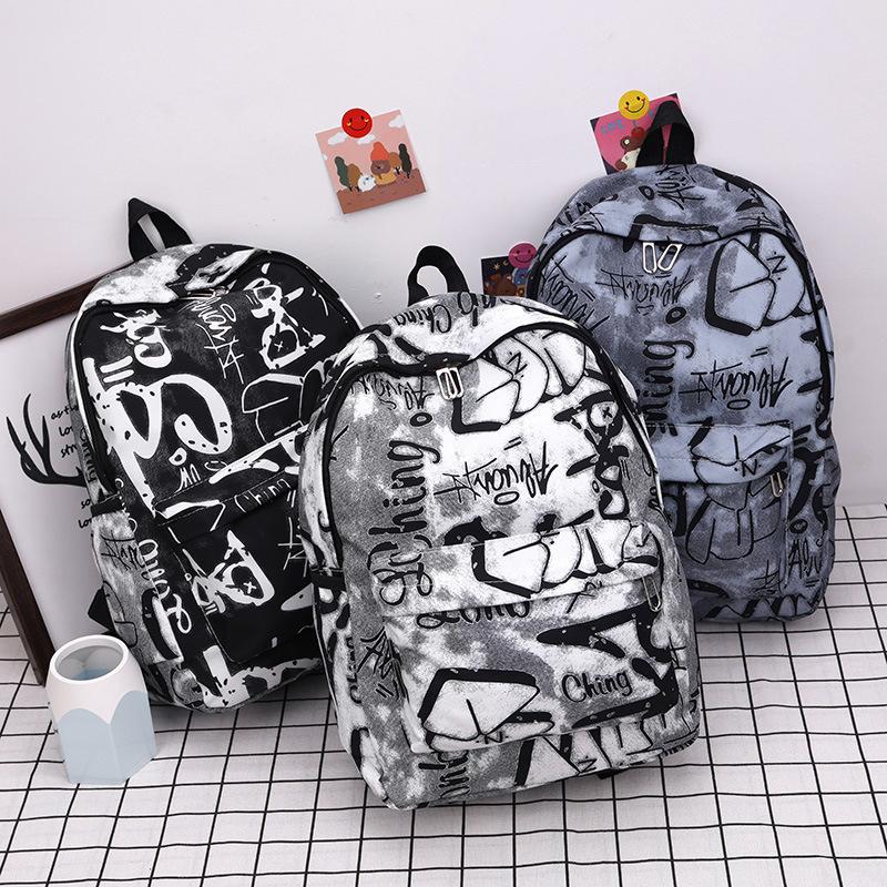 Nouveau Sac à Dos Scolaire Couple Lettres Graffiti Mode Loisirs Voyage Multifonctionnel