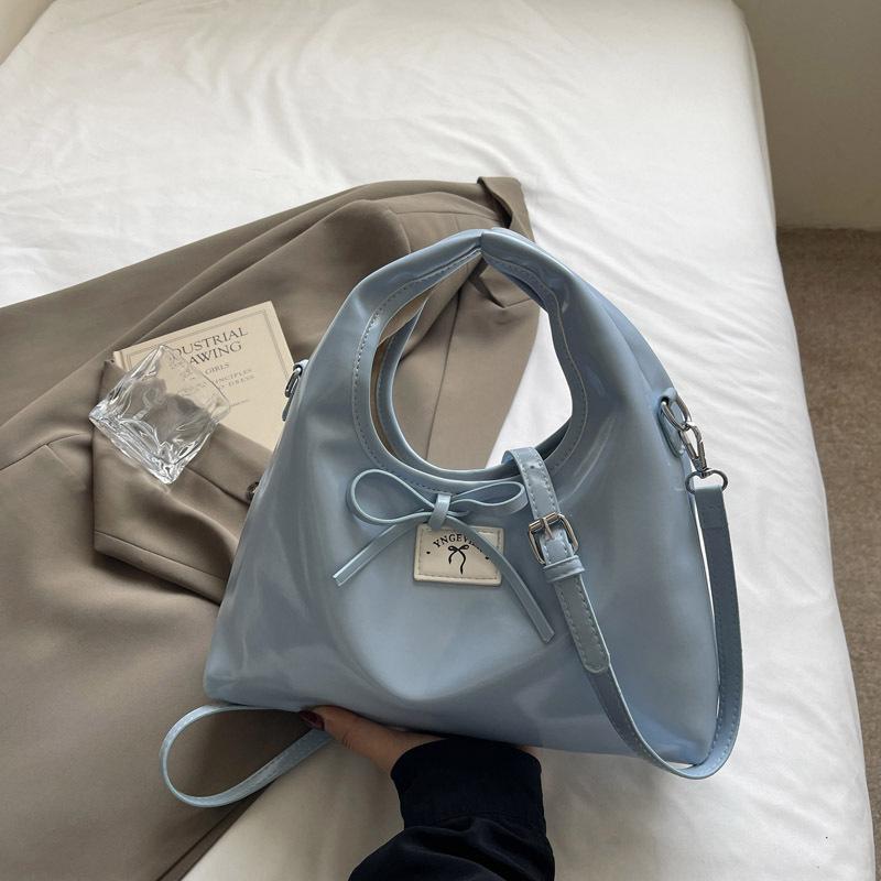 

Portable bow dumpling bag women s fashion shoulder bag 2025 new simple and versatile women s bag