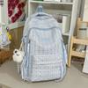 Schoolbag Korean version retro plaid backpack large capacity spine protection to reduce the burden on primary school students, junior high school 
