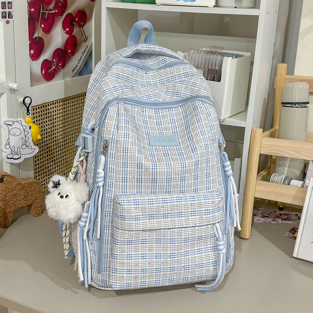 Schoolbag Korean version retro plaid backpack large capacity spine protection to reduce the burden on primary school students, junior high school