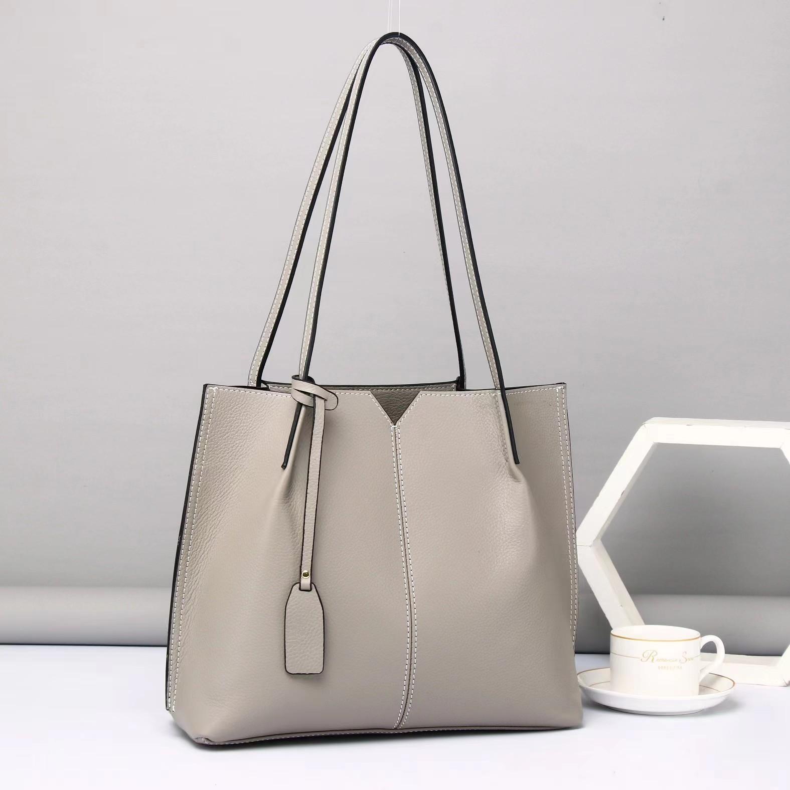 

Новые простые и модные вместительные кожаные женские сумки, сумки-тоуты подмышки, модные и универсальные сумки через плечо. 31*12*27cm серый