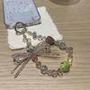Sweet and cool wind butterfly beaded pendant ins niche design high-end mobile phone chain lanyard simple ccd key pendant