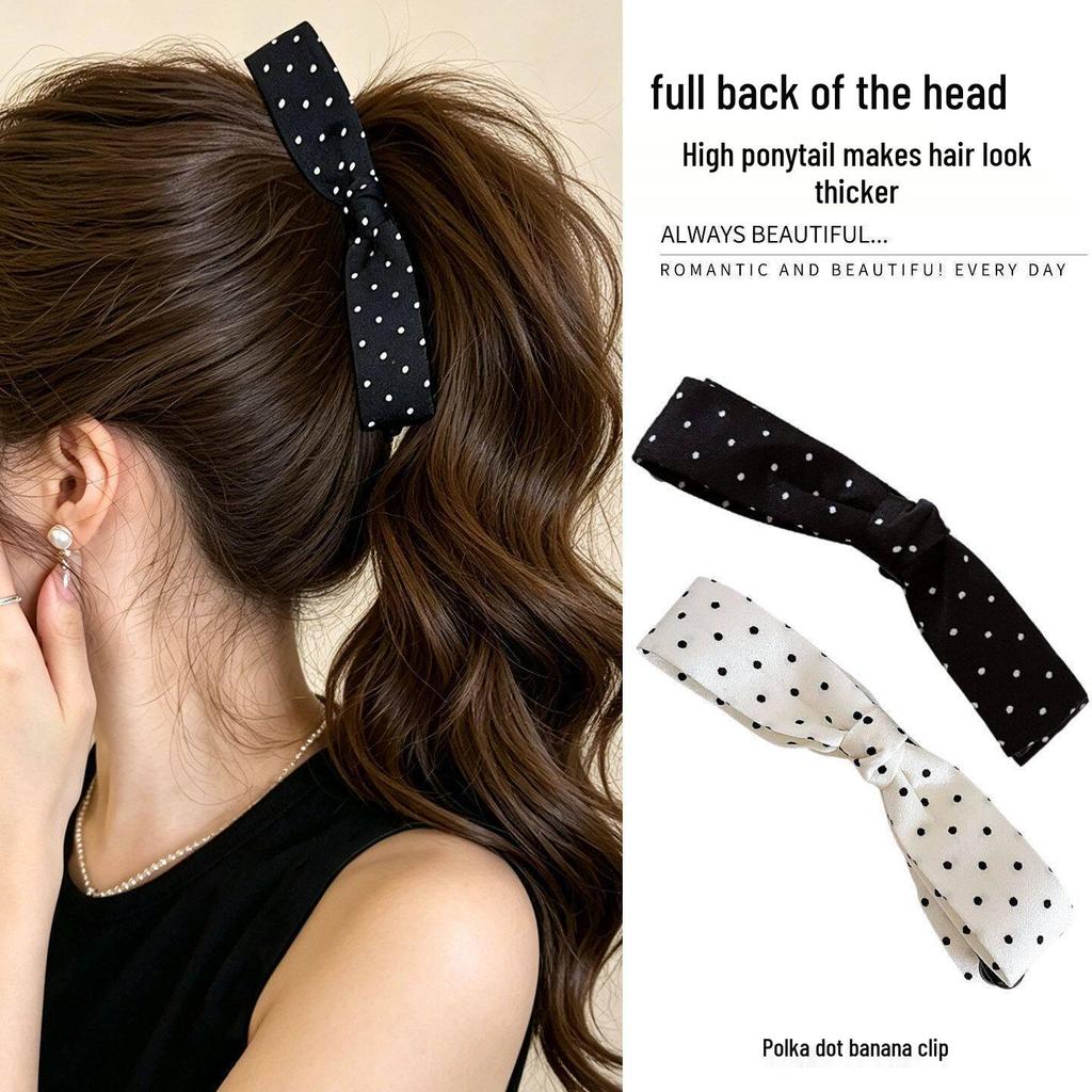 Elegant Black & White Polka Dot Bow Banana Clip: Fashionable Hair Accessory for Women.
