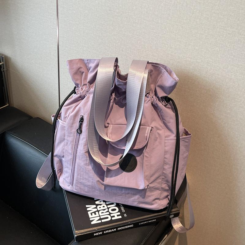 

Женская сумка большой вместимости новая летняя универсальная на плечо с кулиской сумка-тоут повседневный многофункциональный рюкзак фиолетовый