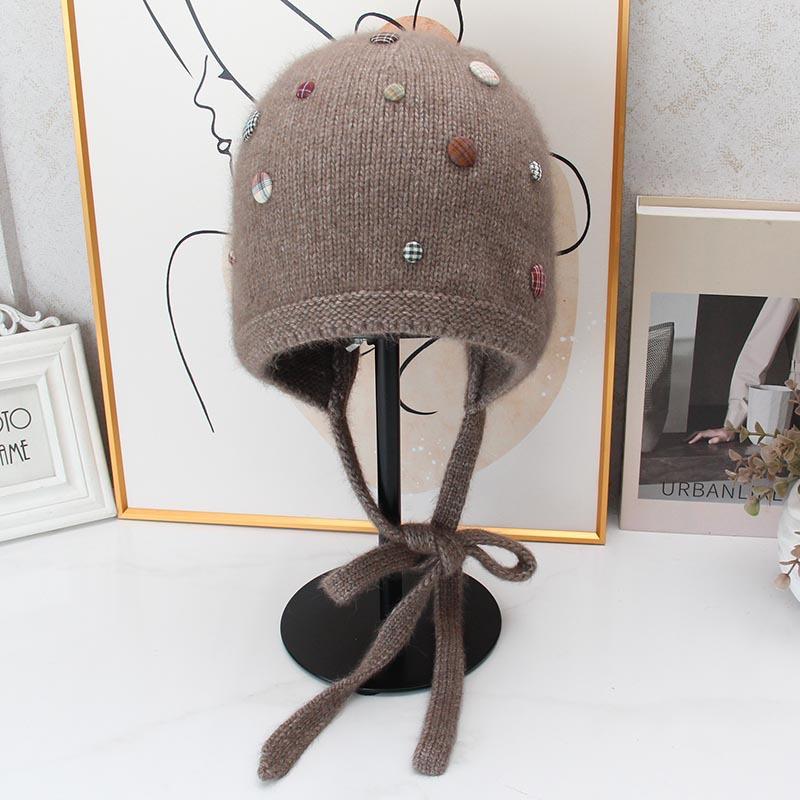 Autumn and winter Angola rabbit fur ear protection knitted hat women's color button decorative lace-up wool hat outdoor cold hat tide