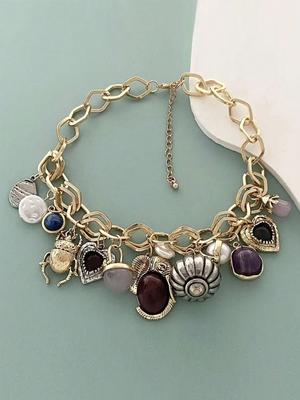 A Chunky Chain Necklace Featuring An Engraved Heart-Shaped Pendant, Insect And Animal Motifs, And A Vintage-Style Multi-Pendant Necklace.