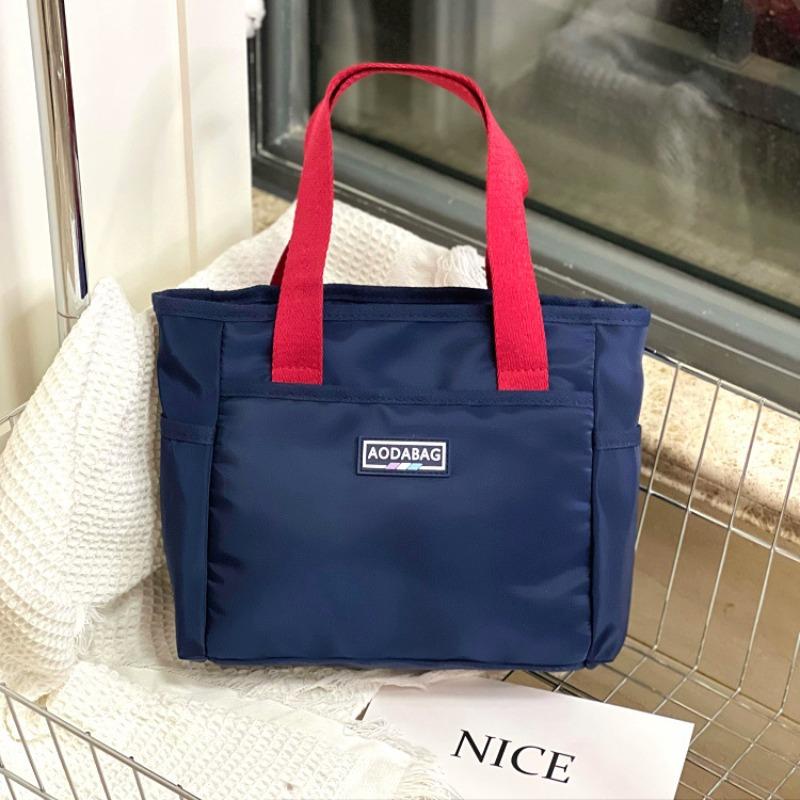 

New contrasting colors Korean version niche handbag commuting to work hand carry documents snacks sundries bag lunch bag