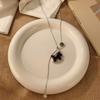 Flash zirconium coffee color Trojan horse pendant can pull necklace women's niche design long high-end wooden pony sweater chain