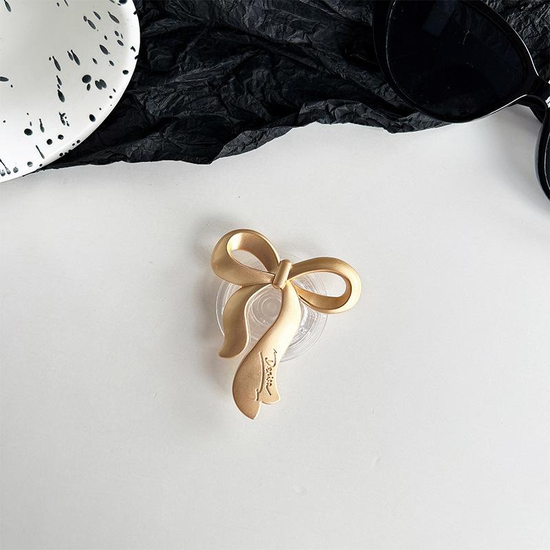 

Electroplated Metal Bow Mobile Phone Airbag Holder Simple Back Sticker Niche Watch Drama Bracket Niche