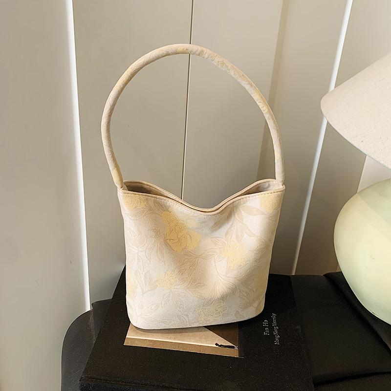 Fashion trend niche design bucket bag 2025 summer new casual texture women's shoulder messenger bag