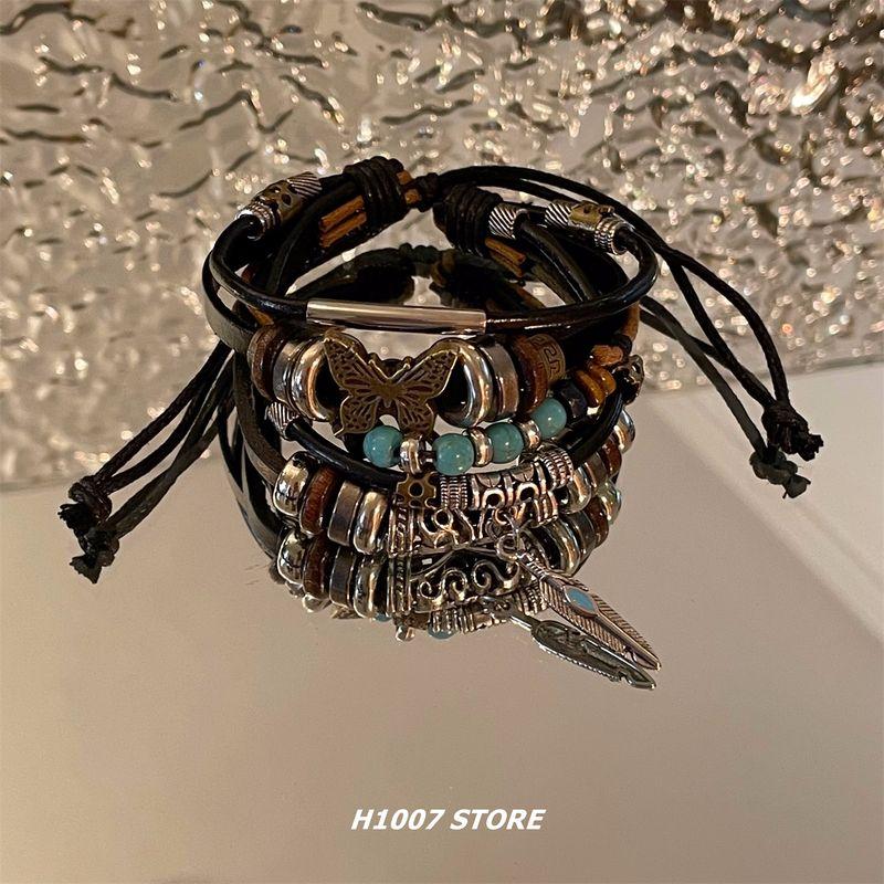 

Этнический стиль Кожаный плетеный многослойный мужской браслет Браслет для девушек Нишевый мужской ремешок ПАРНЫЕ Европейские и американские украшения A butterfly multi-layer