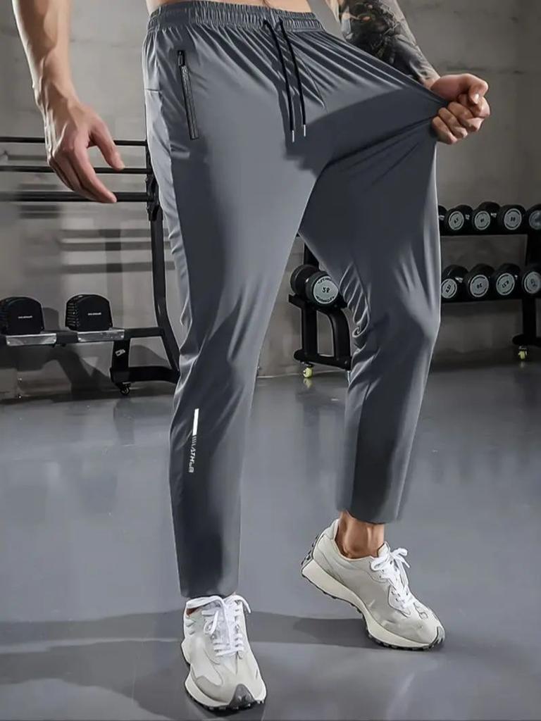 Herren Freizeit-Sporthose, Hochdehnbare Webware, Einfarbig, Normale Passform mit Kordelzugbund und Reißverschluss