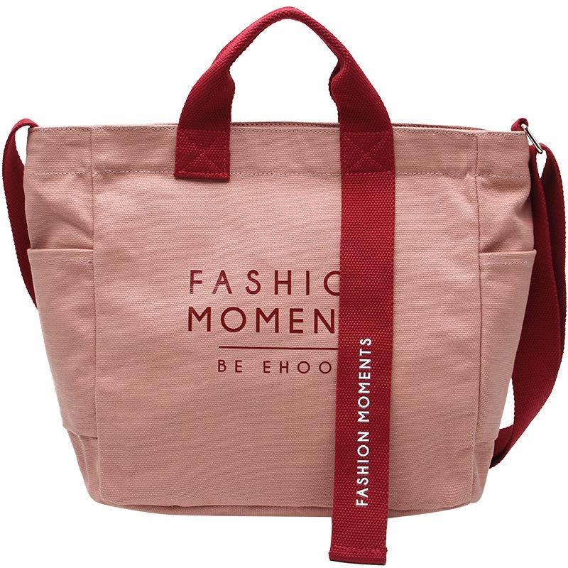 

2025 Four Seasons Universal Korean Edition Solid Color Canvas Bag Women s Shoulder Bag College Student Class Bag Crossbody Bag Letter Pattern розовый