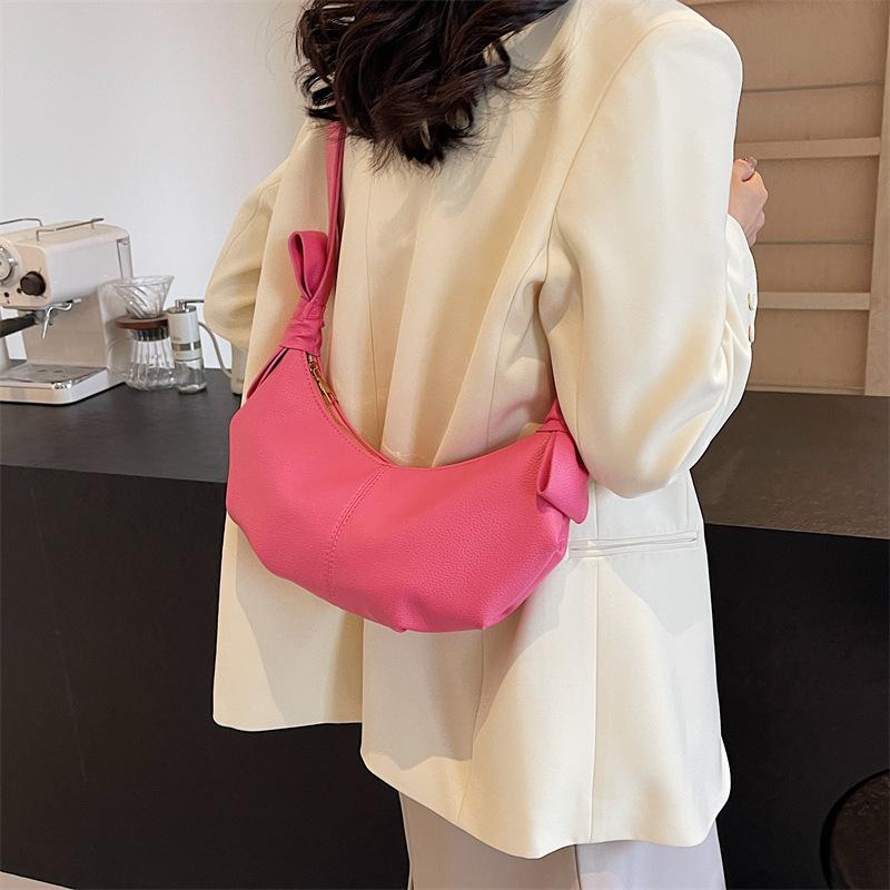 This year, the popular small bag women's 2025 spring new messenger bag high-end texture versatile single shoulder crescent dumpling bag