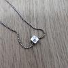 Used moschino silver necklace square dice