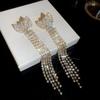 Elegant Silver Rhinestone Bow Tassel Earrings: Luxury Ear Studs for Women