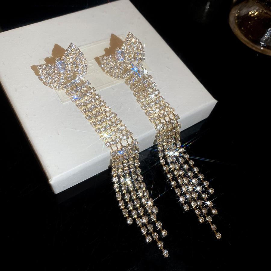 Elegant Silver Rhinestone Bow Tassel Earrings: Luxury Ear Studs for Women