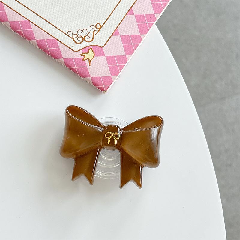 

Solid Color Girl Bow Mobile Phone Airbag Bracket Wind Paste Retractable Desktop Watching Drama Support