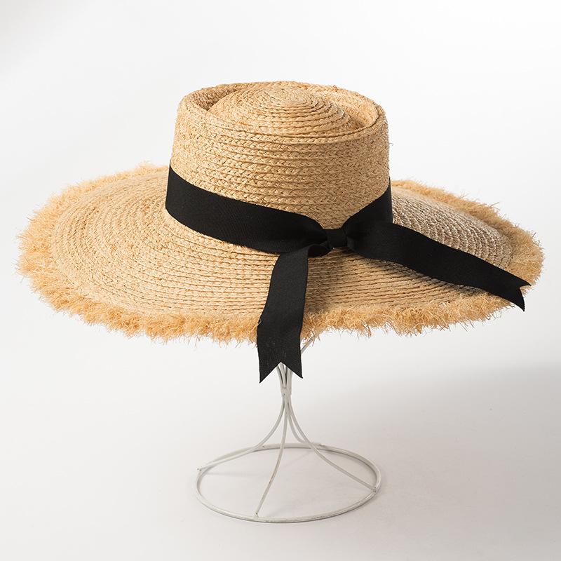 Spring and summer new ring flat top bow streamer raffia big eaves hat women's sunshade rough edge beach straw hat