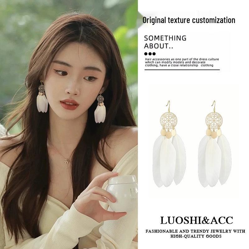 

Ethereal Tassel Earrings: Bohemian Ethnic Studs for Women - Holiday Style from Xinjiang, Tibet, Yunnan