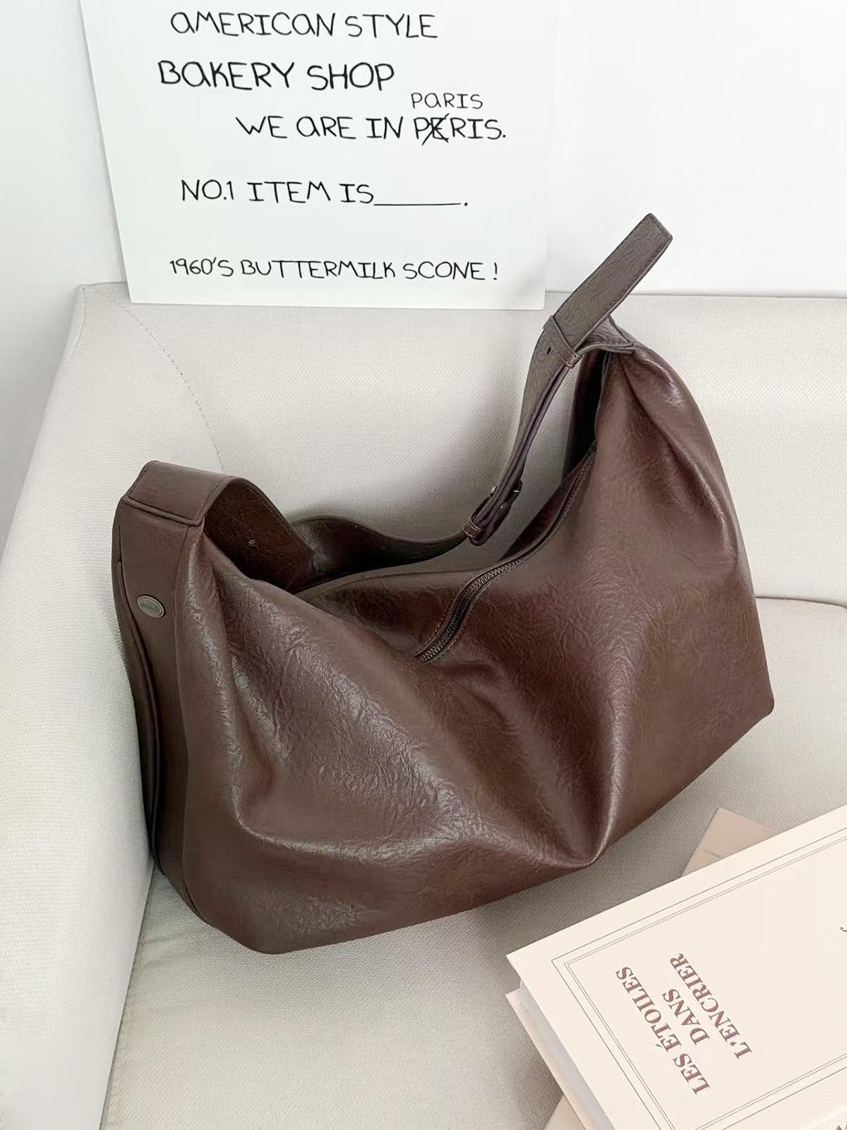 

Large capacity tote bag women s 2025 new dark shoulder dumpling bag women s high-end sense versatile commuter messenger bag